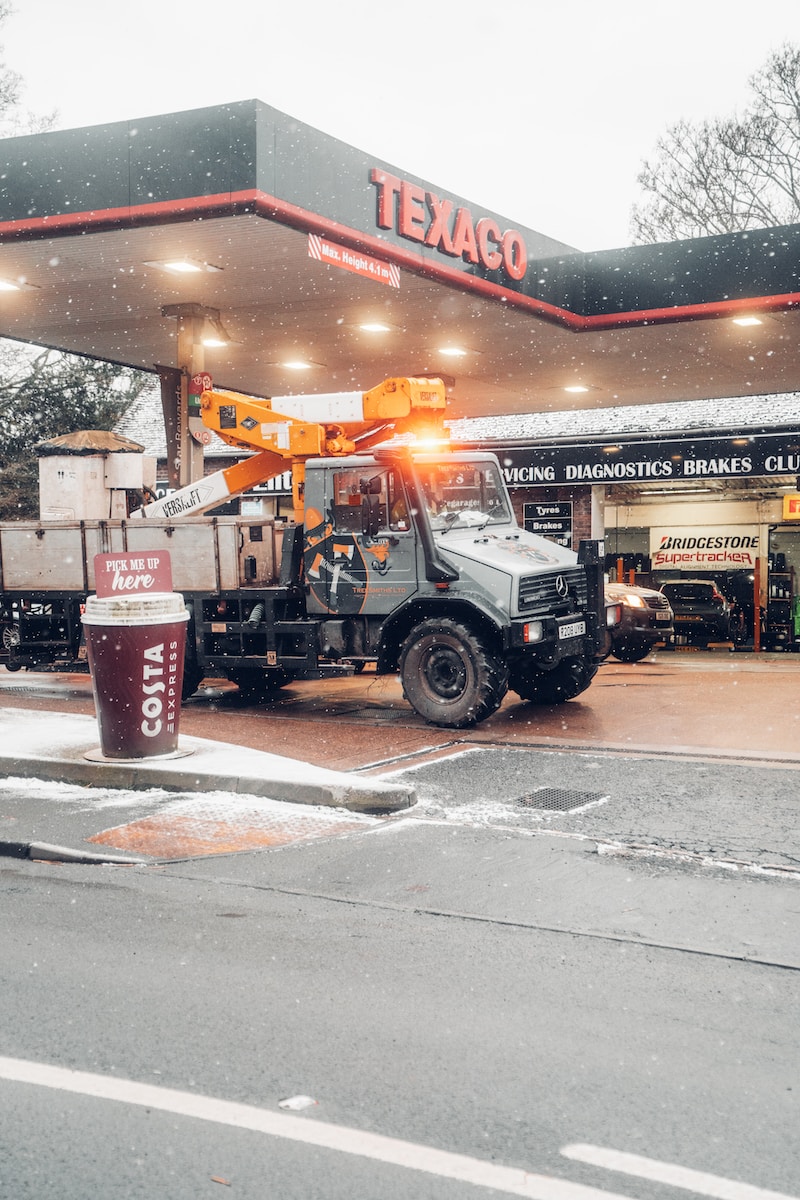 a truck is parked at a gas station
